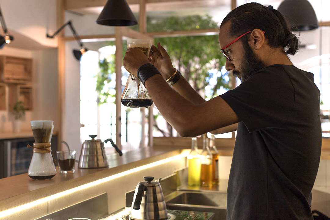 Rajeev brewing a pot of coffee.